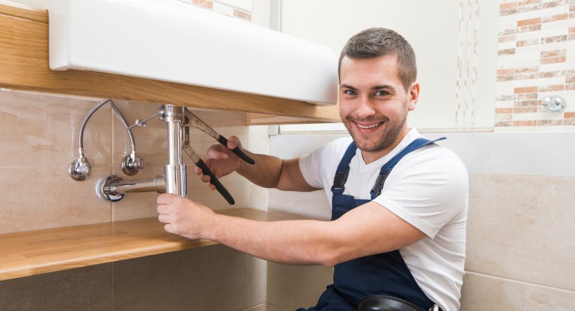 repairing kitchen sink plumbing in a Toronto home