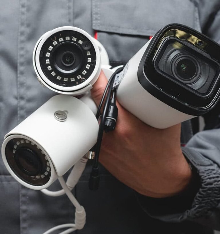 Certified security camera installer setting up indoor CCTV monitoring system in Toronto commercial property