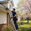 Handyman cleaning gutters in Toronto — spring home maintenance checklist in action